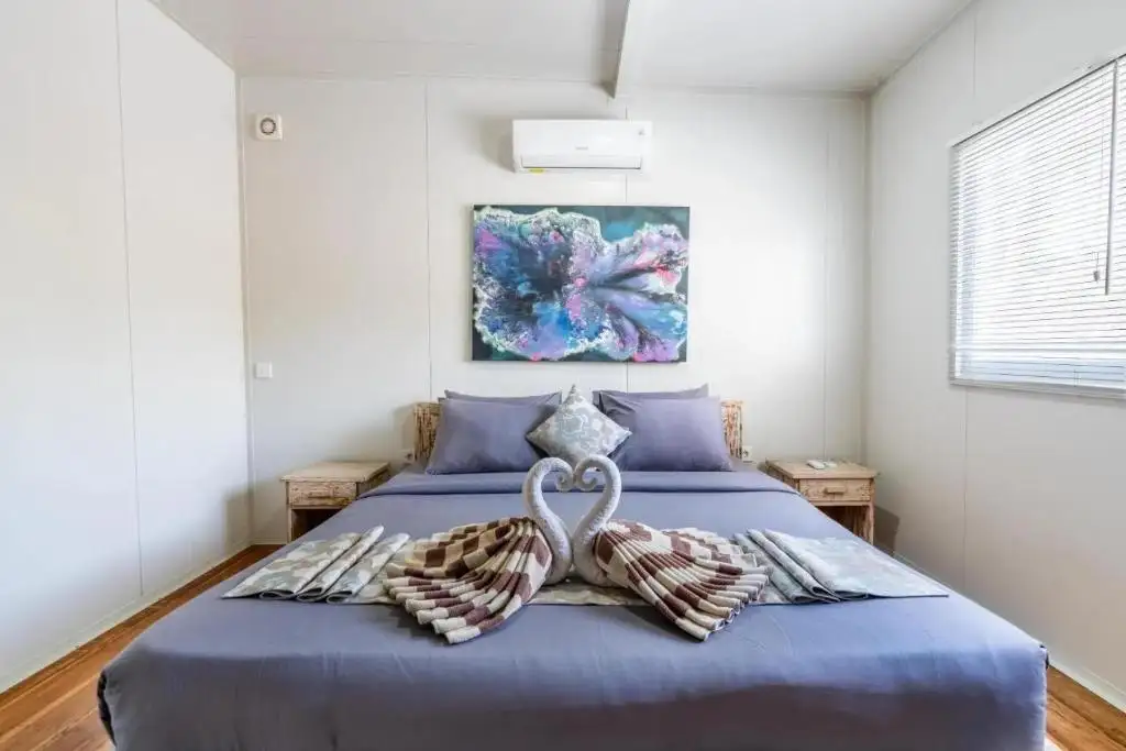 Master bedroom with towel swans