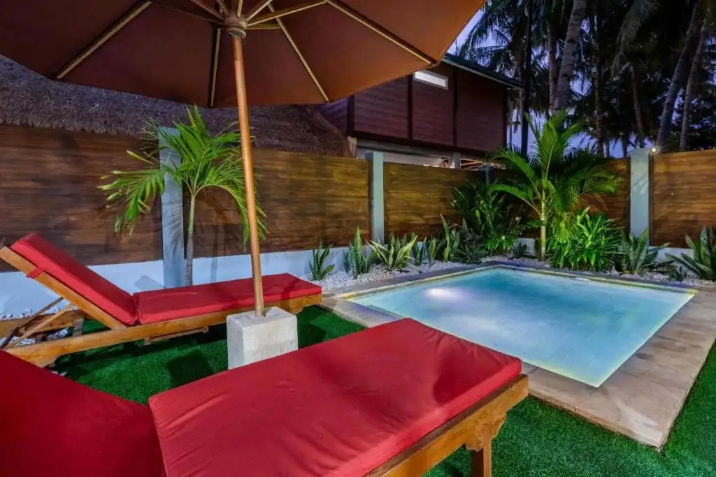 Evening by the pool under the parasol